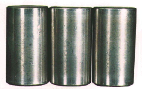 Dents on tapered rollers from contact with debris.